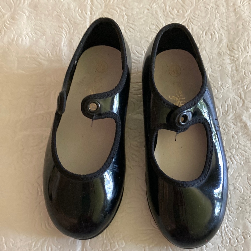 Tap shoes. Size 8 1/2. Toddler-young child size. Used with a few scuffs.